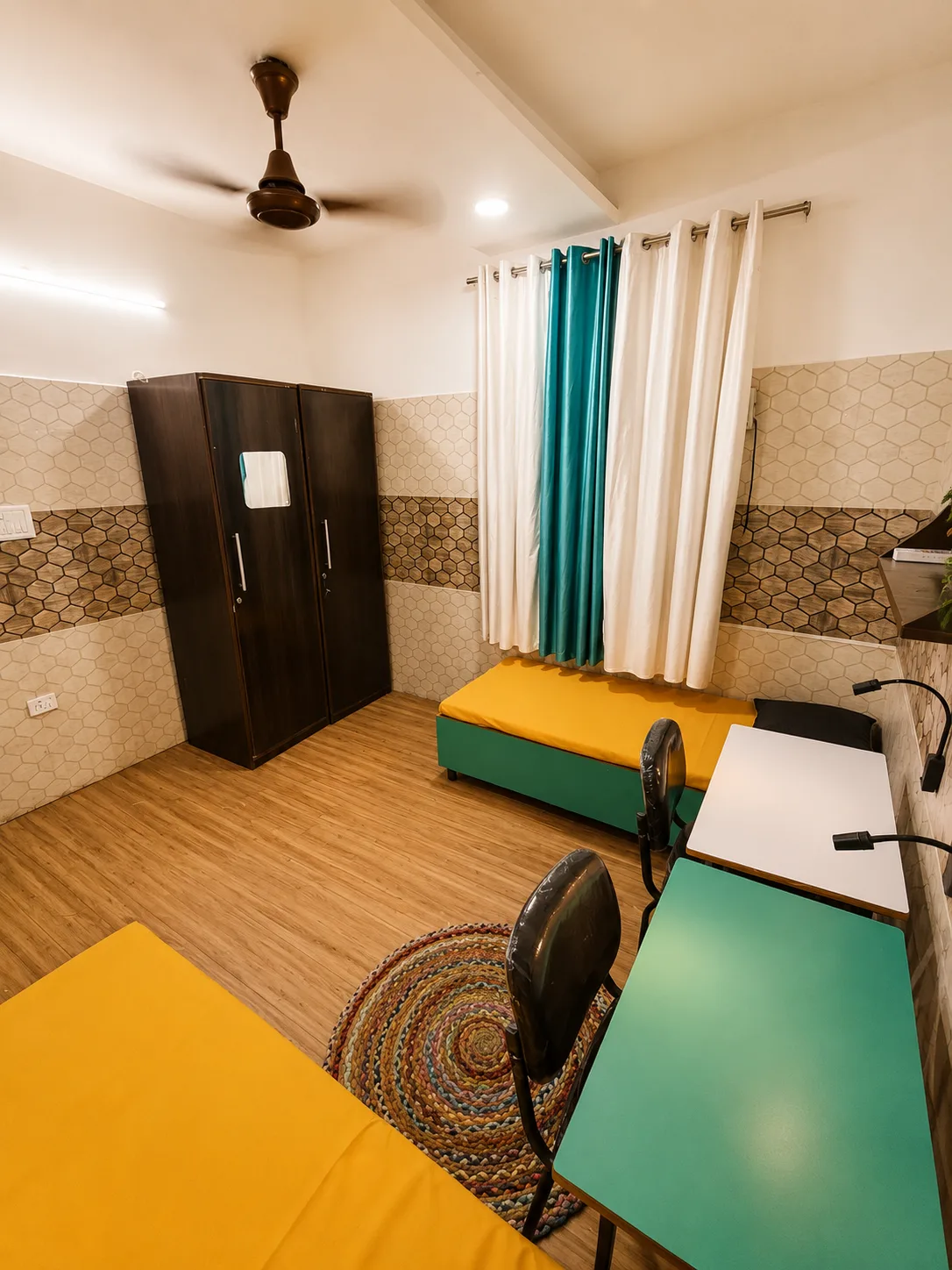 Double sharing room at Duhomes PG Kamla Nagar showing wardrobe and study area