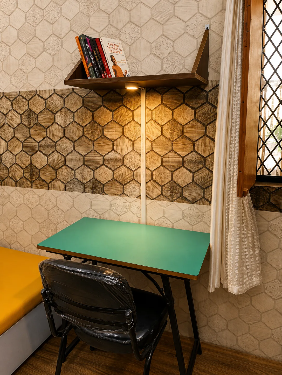 Study desk and chair in room at Duhomes boys PG Kamla Nagar